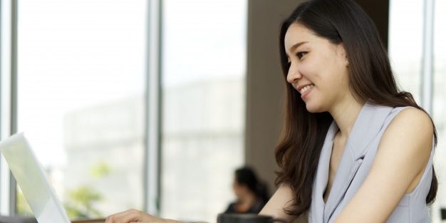 girl-working-laptop-sitting-coffee-shop