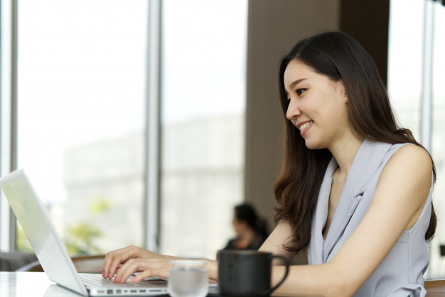 girl-working-laptop-sitting-coffee-shop